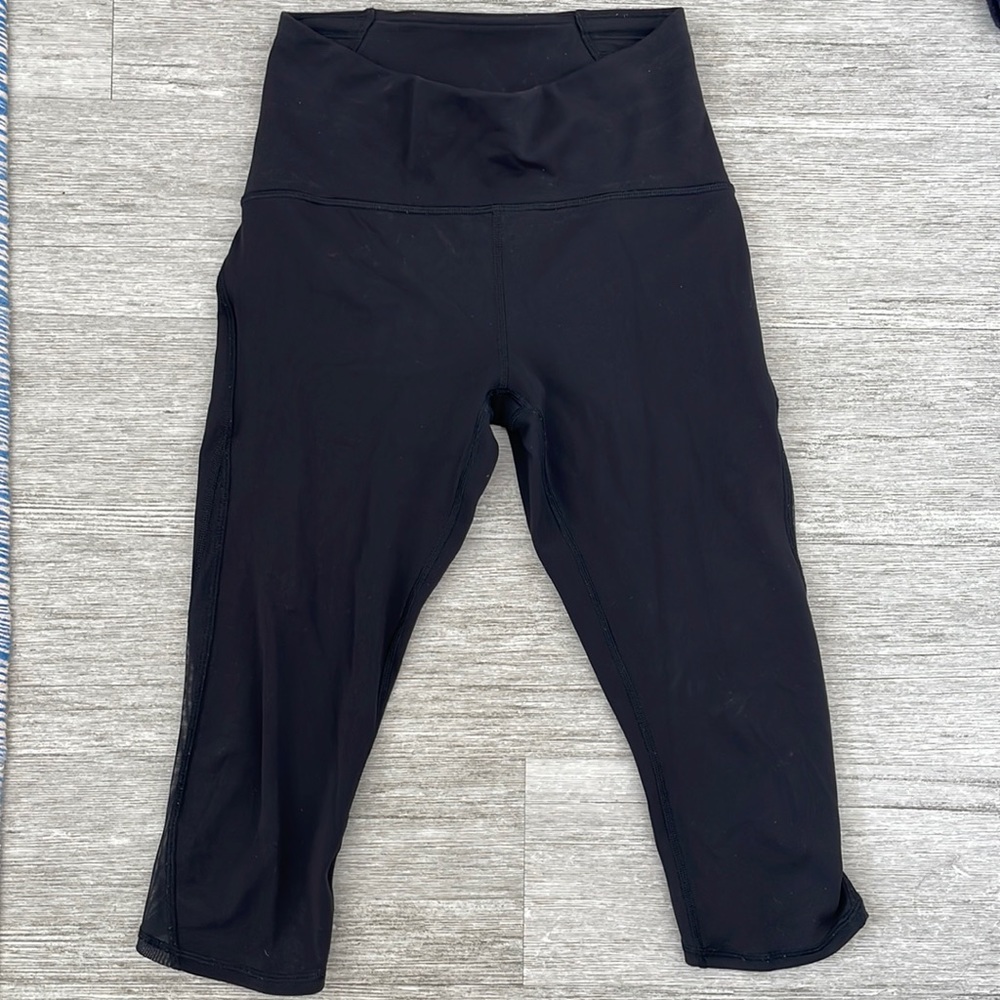 SOLD Lululemon size 6 black crop leggings with mesh detail on sides